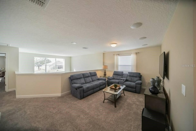 1646 Moon Valley Dr, Davenport, FL 33896 - living room with a textured ceiling, carpet flooring, visible vents, and baseboards