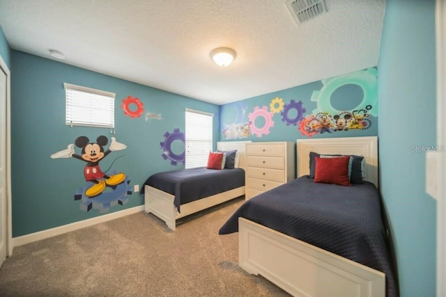 1646 Moon Valley Dr, Davenport, FL 33896 - carpeted bedroom with visible vents, baseboards, and a textured ceiling