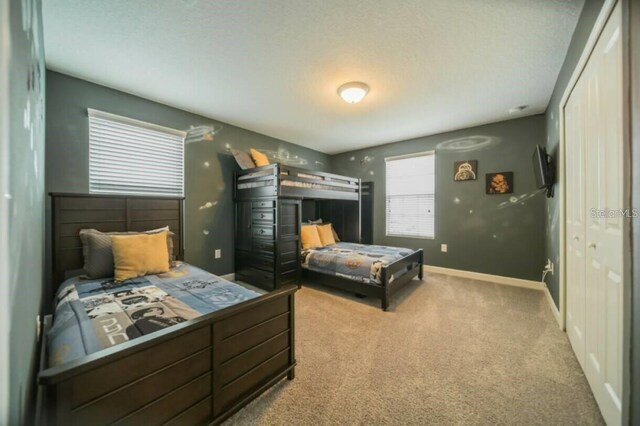 1646 Moon Valley Dr, Davenport, FL 33896 - carpeted bedroom with a closet and baseboards