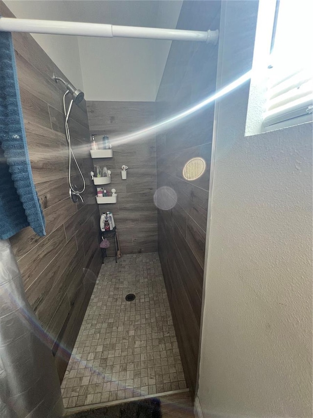 full bath with a shower stall