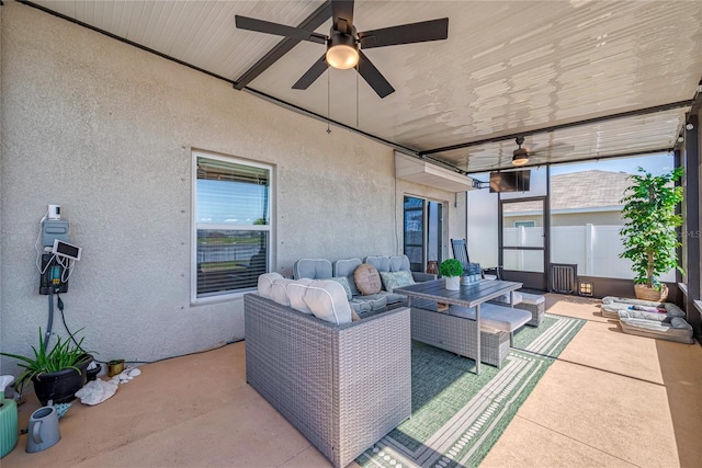 view of patio featuring an outdoor hangout area and a ceiling fan