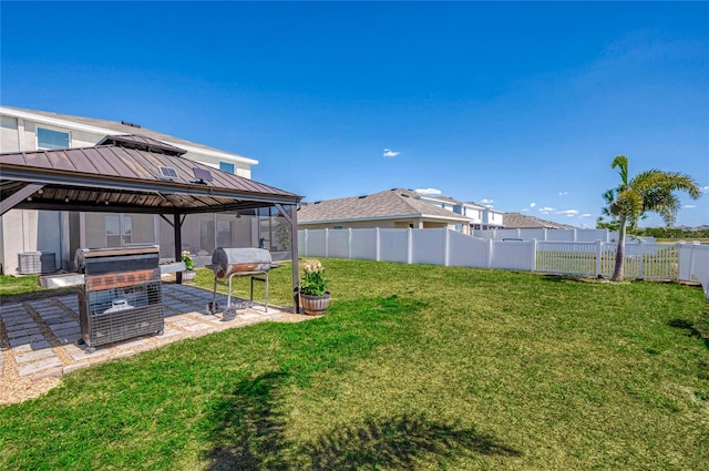 view of yard with fence, a gazebo, and a patio