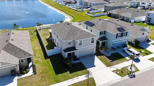 bird's eye view featuring a water view and a residential view