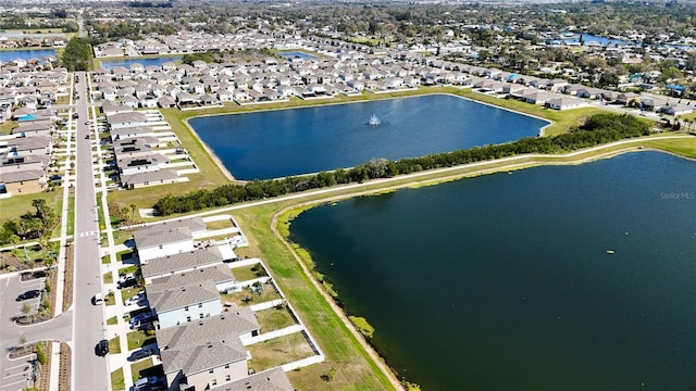 bird's eye view featuring a residential view and a water view