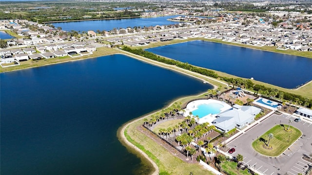 bird's eye view with a water view and a residential view