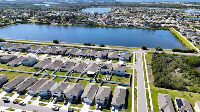 aerial view featuring a residential view and a water view