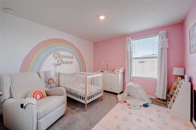 carpeted bedroom with a crib