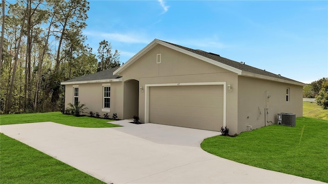 ranch-style home featuring a front yard, an attached garage, and stucco siding