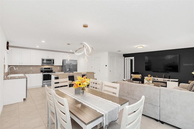 dining space with light tile patterned floors and recessed lighting