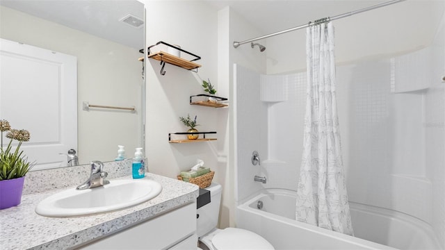 full bath with toilet, vanity, visible vents, and shower / tub combo with curtain