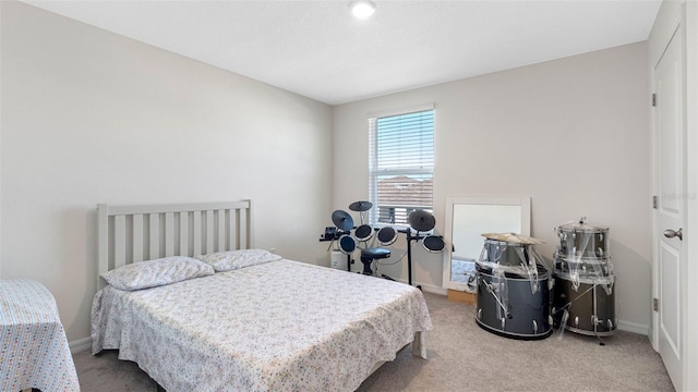 carpeted bedroom with baseboards