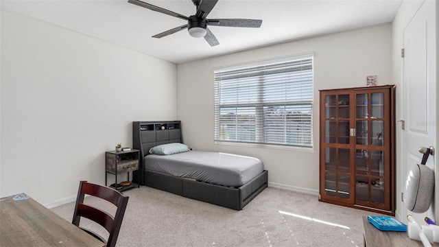 bedroom with carpet, baseboards, and ceiling fan