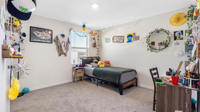 bedroom with carpet floors and baseboards