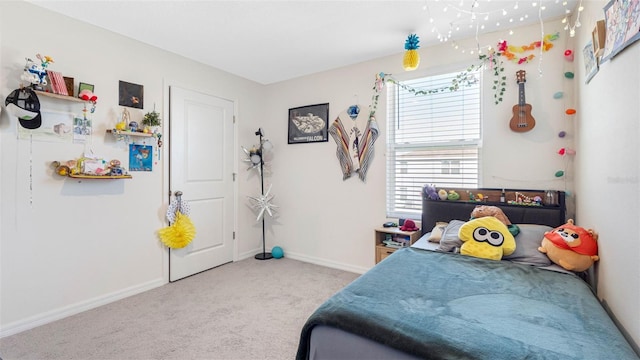 bedroom with carpet flooring and baseboards