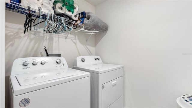 clothes washing area featuring laundry area and washer and dryer