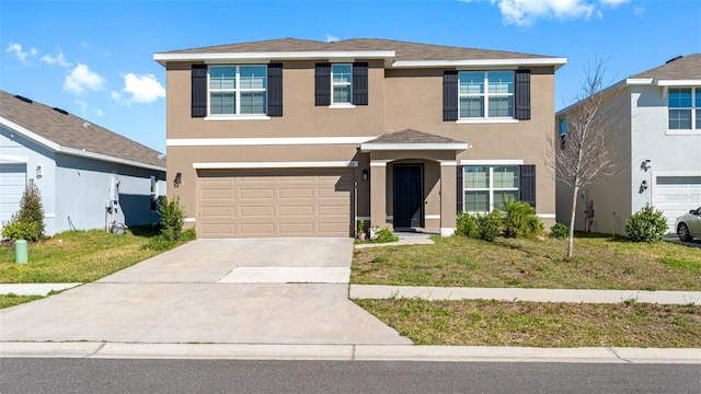 traditional home with a garage, a front yard, concrete driveway, and stucco siding