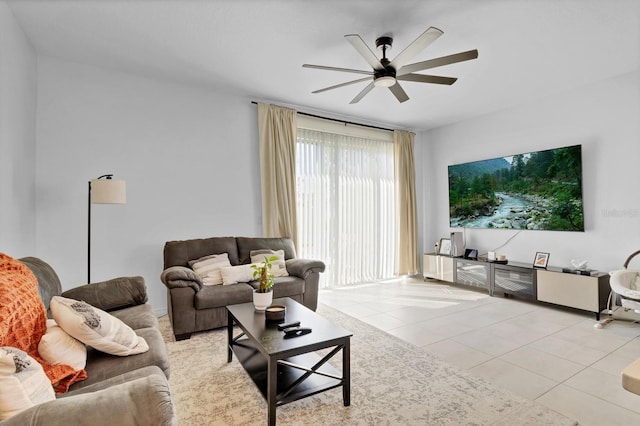 4544 Teoli Ct, Kissimmee, FL 34746 - living area featuring light tile patterned floors and ceiling fan