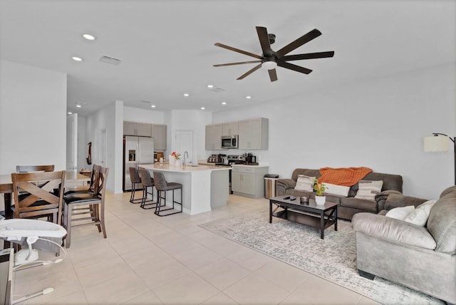 4544 Teoli Ct, Kissimmee, FL 34746 - living area with light tile patterned floors, visible vents, a ceiling fan, and recessed lighting