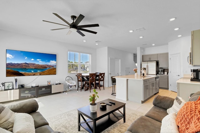 4544 Teoli Ct, Kissimmee, FL 34746 - living area featuring a ceiling fan, recessed lighting, visible vents, and light tile patterned floors