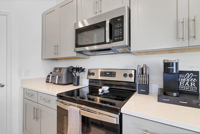4544 Teoli Ct, Kissimmee, FL 34746 - kitchen featuring stainless steel appliances and light countertops