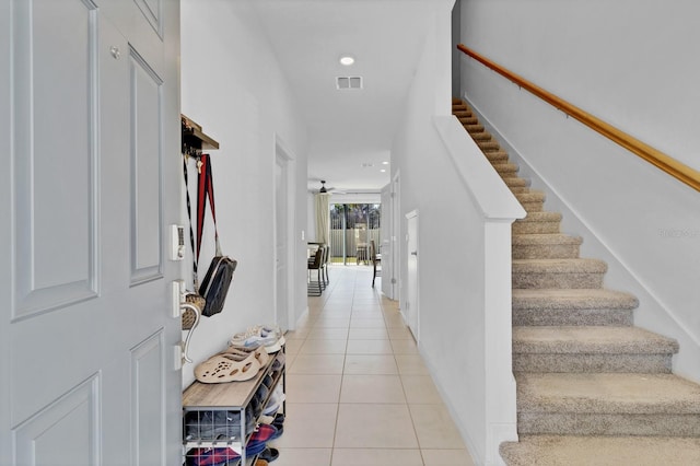 4544 Teoli Ct, Kissimmee, FL 34746 - foyer with visible vents, a ceiling fan, stairs, light tile patterned flooring, and recessed lighting
