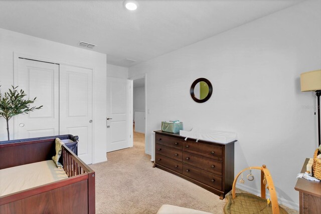 4544 Teoli Ct, Kissimmee, FL 34746 - bedroom featuring baseboards, a closet, visible vents, and light colored carpet