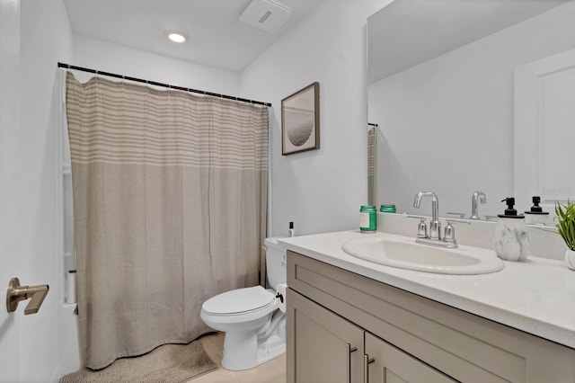 4544 Teoli Ct, Kissimmee, FL 34746 - bathroom with a shower with curtain, vanity, toilet, and recessed lighting
