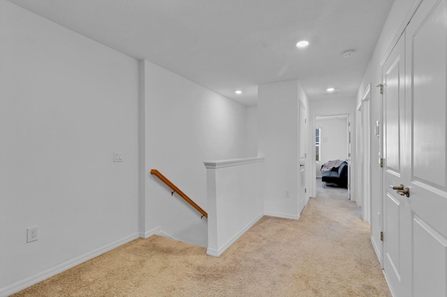 4544 Teoli Ct, Kissimmee, FL 34746 - hall featuring light carpet, baseboards, an upstairs landing, and recessed lighting