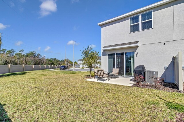 4544 Teoli Ct, Kissimmee, FL 34746 - view of yard with a patio area and fence