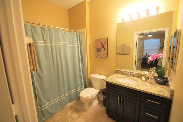 full bathroom featuring vanity, toilet, and tile patterned floors