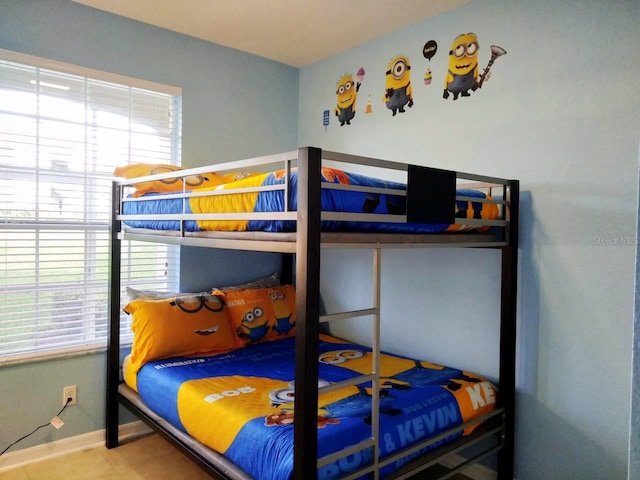 tiled bedroom with baseboards