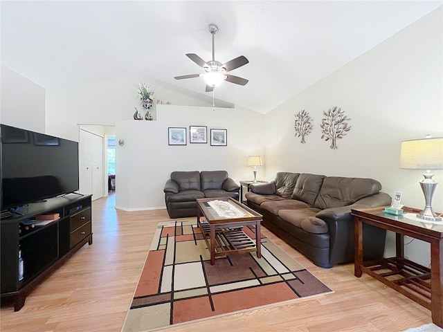 living area with ceiling fan, high vaulted ceiling, and light wood-style flooring