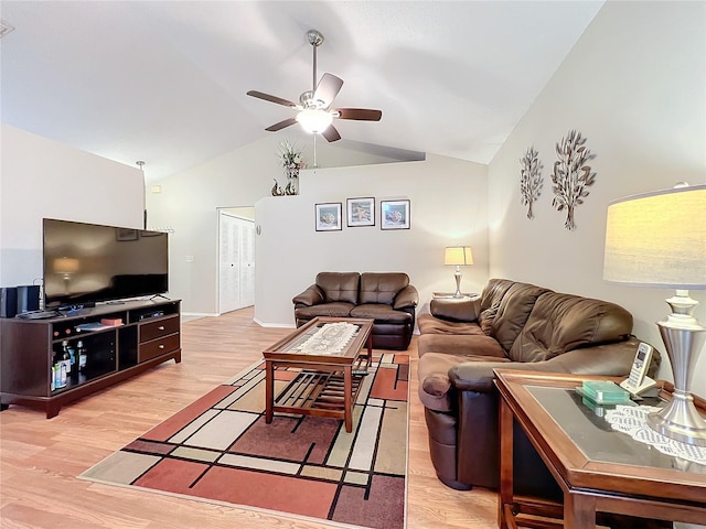 living room featuring baseboards, light wood-style flooring, high vaulted ceiling, and a ceiling fan