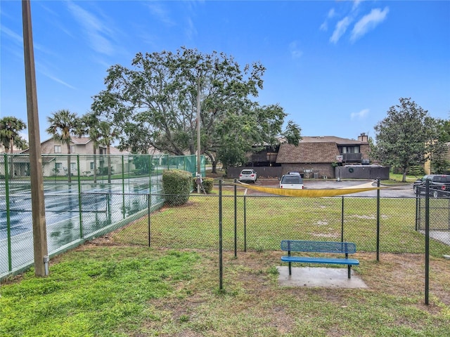 surrounding community featuring a yard, a residential view, and fence