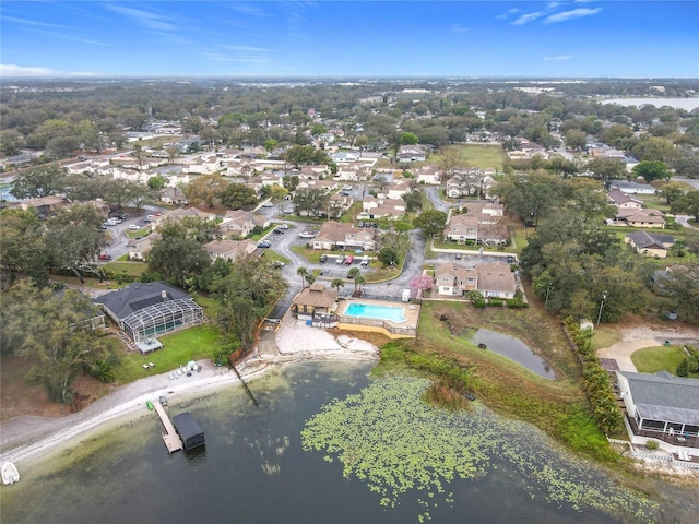 birds eye view of property with a water view and a residential view