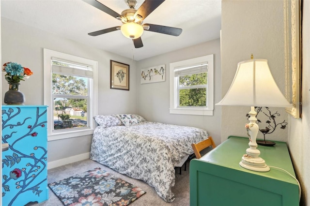 bedroom featuring carpet, baseboards, and a ceiling fan