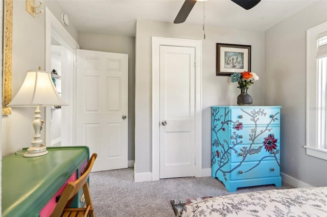 bedroom featuring ceiling fan, carpet, and baseboards