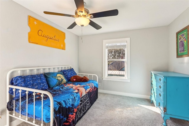 bedroom with ceiling fan, carpet, and baseboards