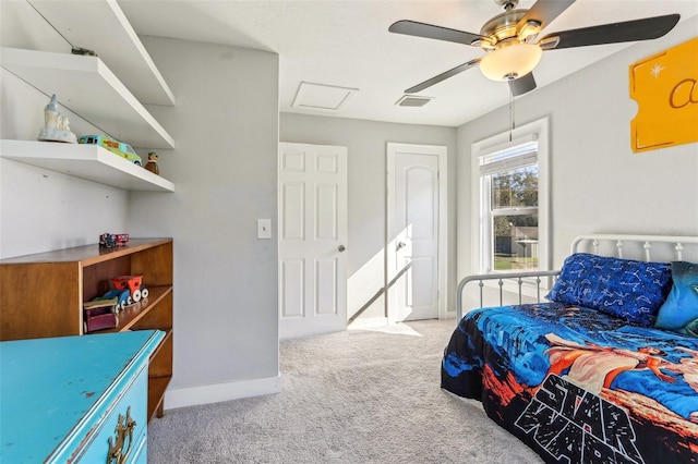 bedroom featuring visible vents, attic access, a ceiling fan, carpet flooring, and baseboards