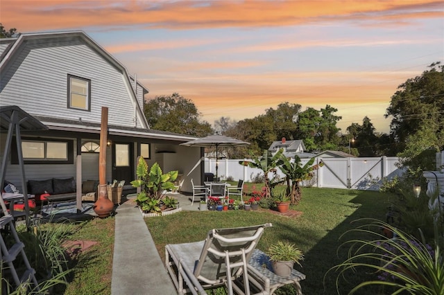 view of yard with a gate, a patio area, and a fenced backyard