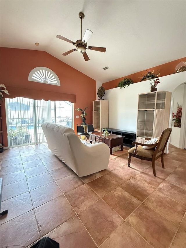 living room with lofted ceiling, visible vents, and a ceiling fan