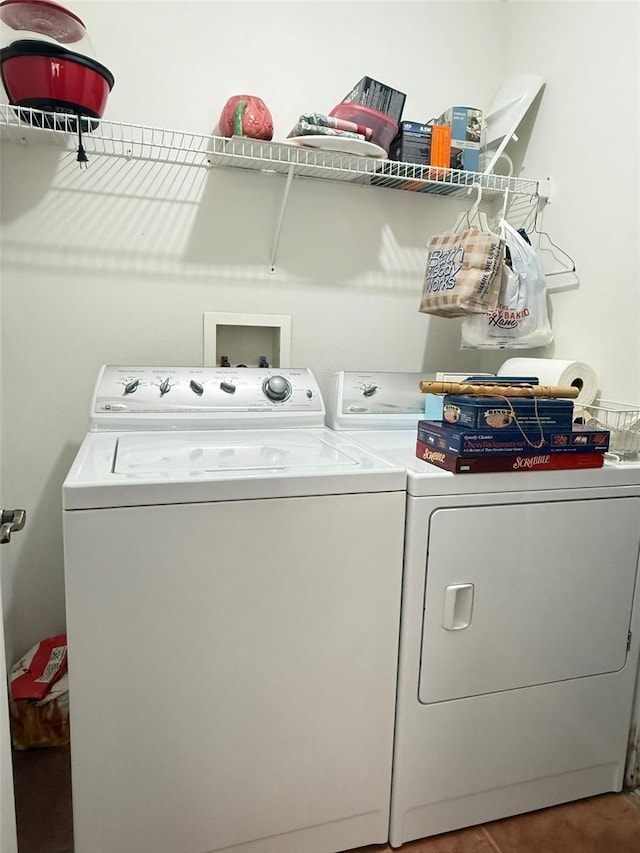 washroom featuring laundry area and separate washer and dryer