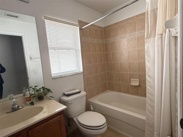 bathroom featuring toilet, shower / bath combo, visible vents, and vanity