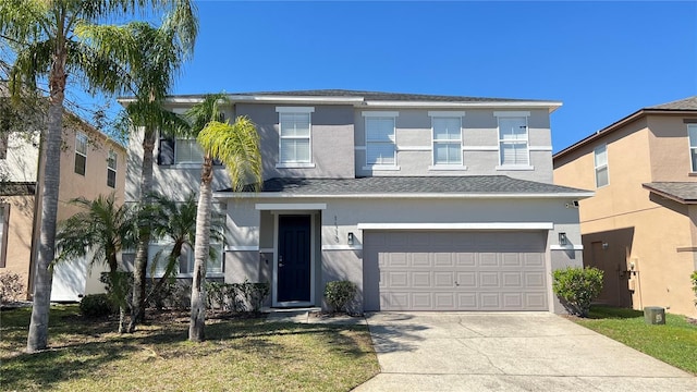 traditional home with driveway, an attached garage, and stucco siding