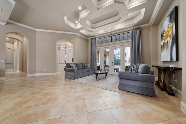 living area featuring arched walkways, light tile patterned floors, a high ceiling, french doors, and crown molding