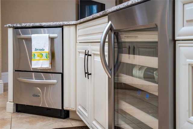 room details featuring stone countertops, wine cooler, and dishwasher