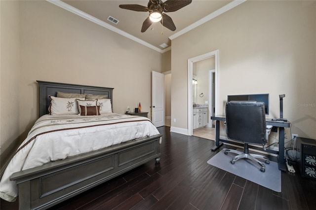 bedroom with dark wood-style flooring, visible vents, ensuite bathroom, ornamental molding, and baseboards