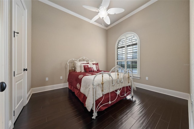 bedroom featuring crown molding, baseboards, ceiling fan, and dark wood-type flooring