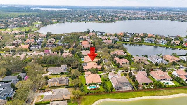 bird's eye view featuring a water view and a residential view