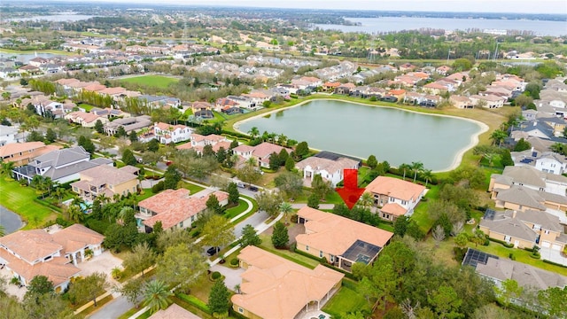 bird's eye view with a residential view and a water view